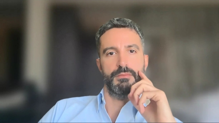 Das Bild zeigt einen Screenshot von Mark Hassoun aus dem Webinar.